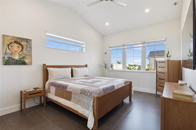 3705 Ridge Run Dr, Minneola, FL 34715 - bedroom with baseboards, dark tile patterned floors, ceiling fan, and lofted ceiling