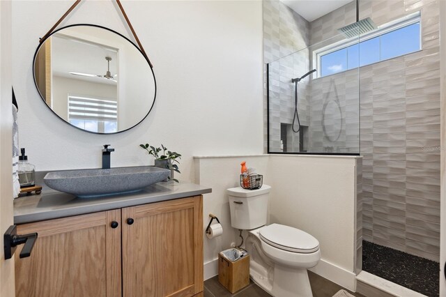 3705 Ridge Run Dr, Minneola, FL 34715 - bathroom featuring a walk in shower, a ceiling fan, toilet, and vanity