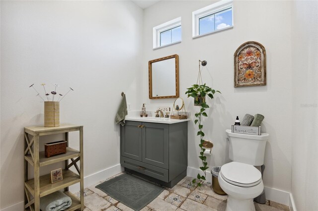 3705 Ridge Run Dr, Minneola, FL 34715 - bathroom with baseboards, vanity, and toilet