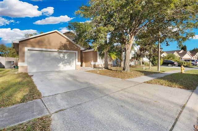 view of front of property featuring central AC, a front lawn, and a garage