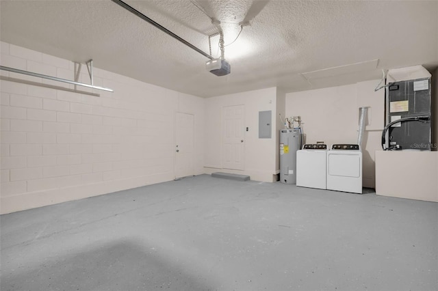 garage featuring water heater, independent washer and dryer, electric panel, heating unit, and a garage door opener