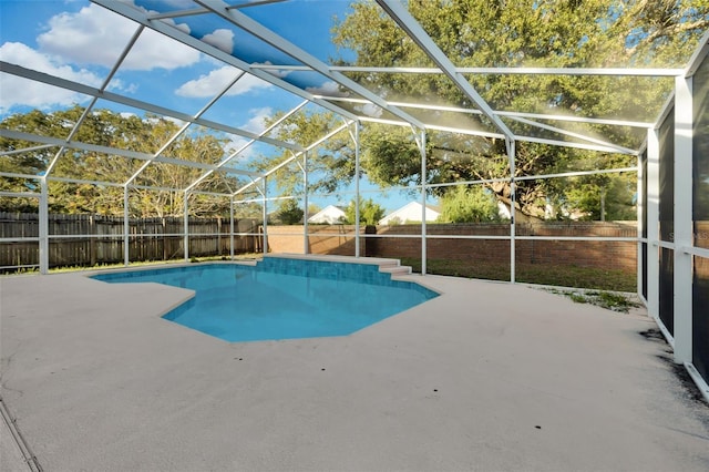 view of pool with a lanai and a patio area