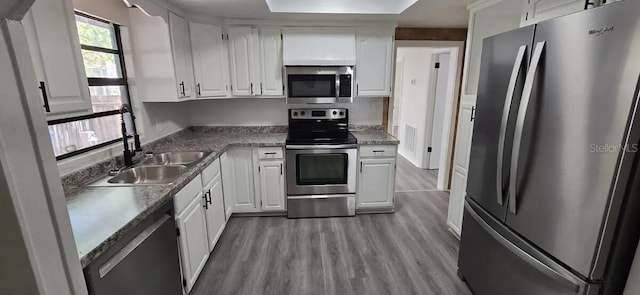 kitchen with white cabinetry, sink, and appliances with stainless steel finishes