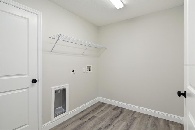 laundry room with electric dryer hookup, washer hookup, and hardwood / wood-style flooring