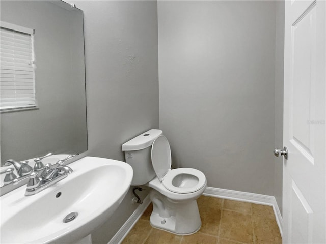 bathroom with sink and toilet