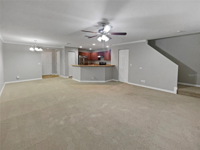 unfurnished living room with ceiling fan with notable chandelier, ornamental molding, and light carpet