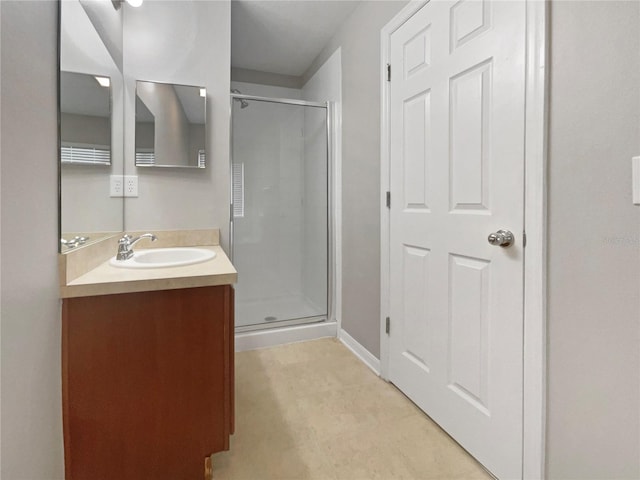 bathroom with vanity and walk in shower