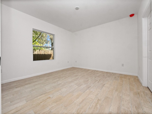 spare room featuring light hardwood / wood-style floors