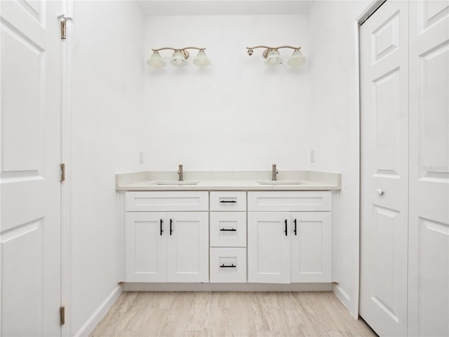 bathroom featuring wood-type flooring and vanity