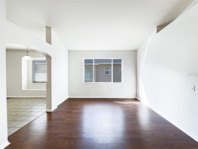 empty room featuring dark wood-type flooring