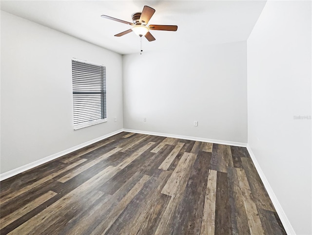 spare room with ceiling fan and dark hardwood / wood-style floors