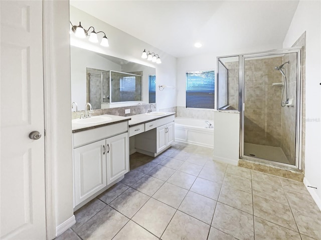 bathroom with vanity, tile patterned flooring, and plus walk in shower