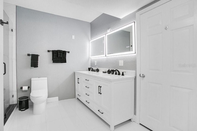 bathroom featuring tile patterned floors, vanity, and toilet