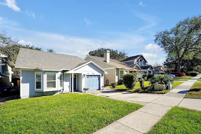 view of front of house featuring a front yard and a garage