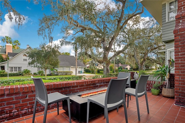 view of patio / terrace with a fire pit