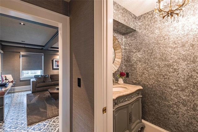 bathroom with vanity and a chandelier