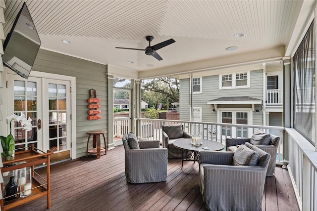 deck featuring ceiling fan and french doors