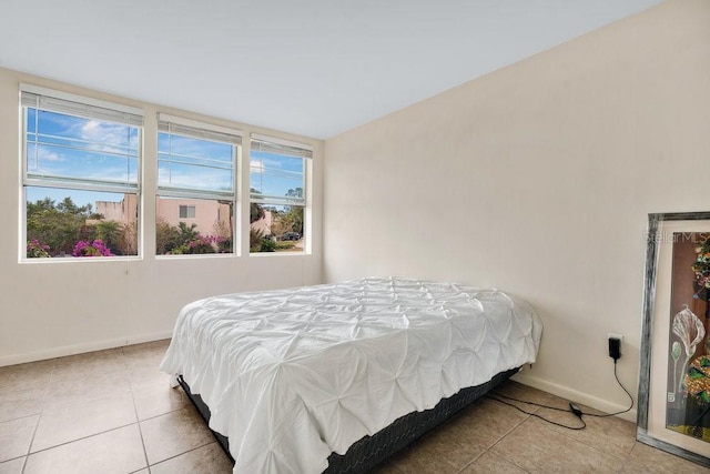 bedroom with light tile patterned floors