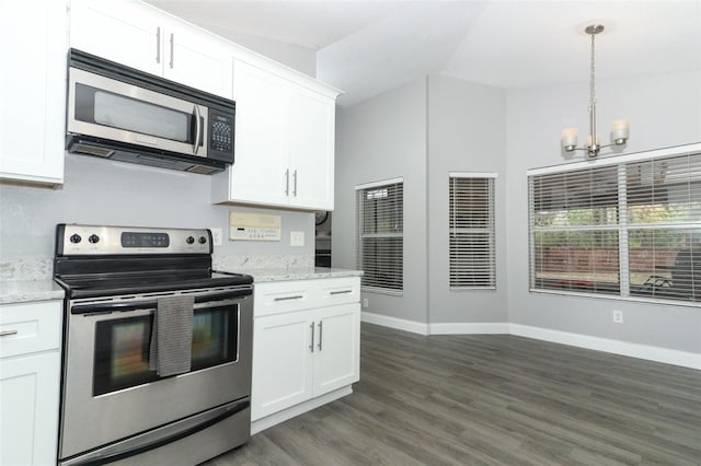 kitchen with light stone countertops, white cabinetry, a chandelier, decorative light fixtures, and appliances with stainless steel finishes