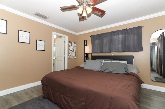 bedroom featuring ceiling fan, crown molding, and dark wood-type flooring