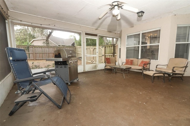 sunroom with ceiling fan