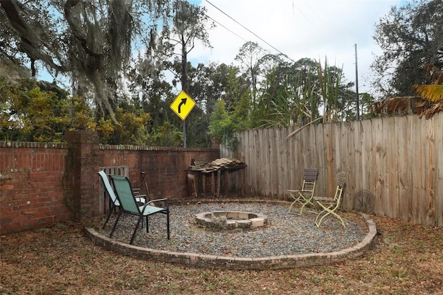 view of yard with a fire pit