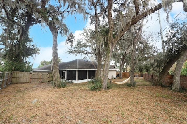 view of yard featuring a sunroom