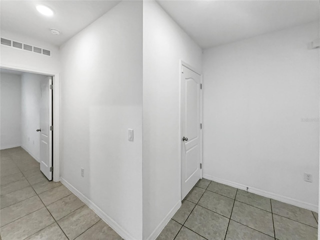 hallway with light tile patterned floors