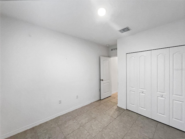 unfurnished bedroom featuring a closet