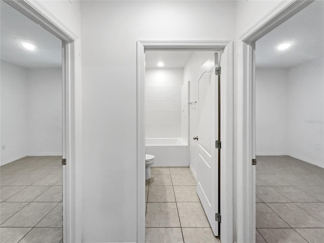 bathroom with tile patterned flooring and toilet