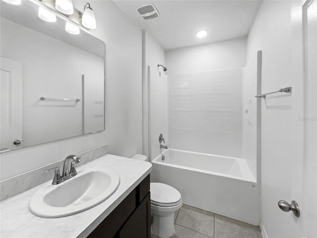 full bathroom featuring tile patterned flooring, vanity, toilet, and washtub / shower combination