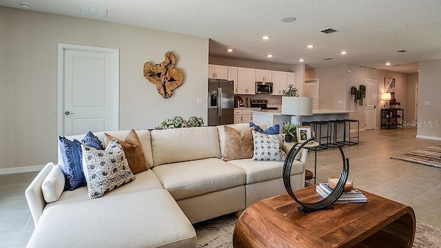 living room with a textured ceiling