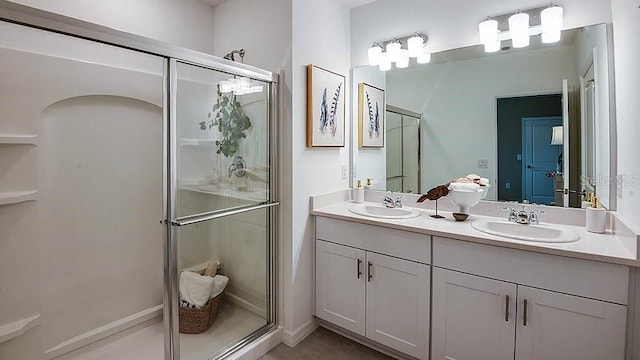 bathroom with vanity, tile patterned floors, and an enclosed shower