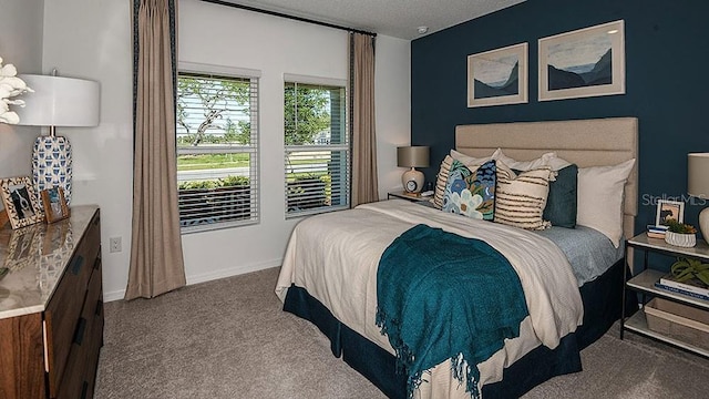 carpeted bedroom with a textured ceiling