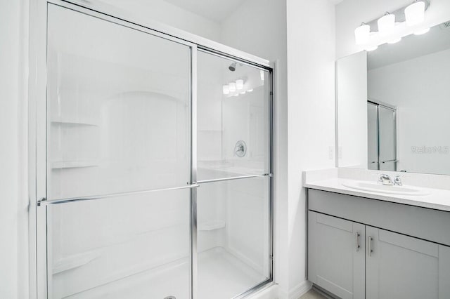 bathroom with vanity and walk in shower