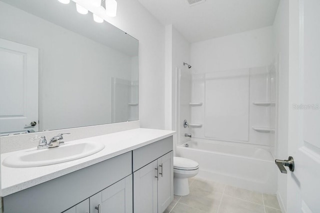 full bathroom with shower / bathing tub combination, vanity, tile patterned flooring, and toilet