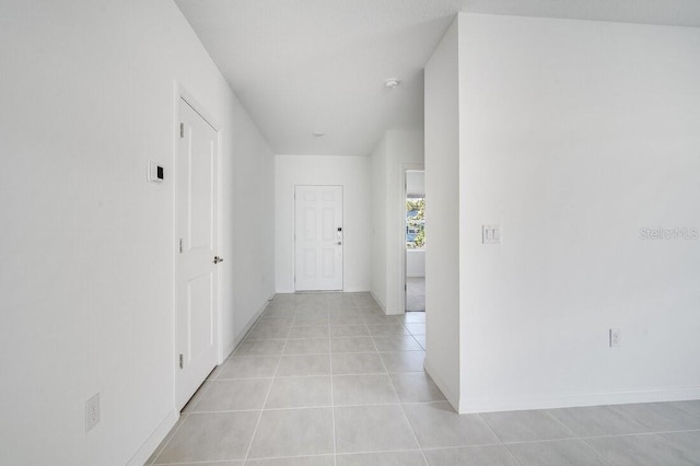 hallway with light tile patterned floors