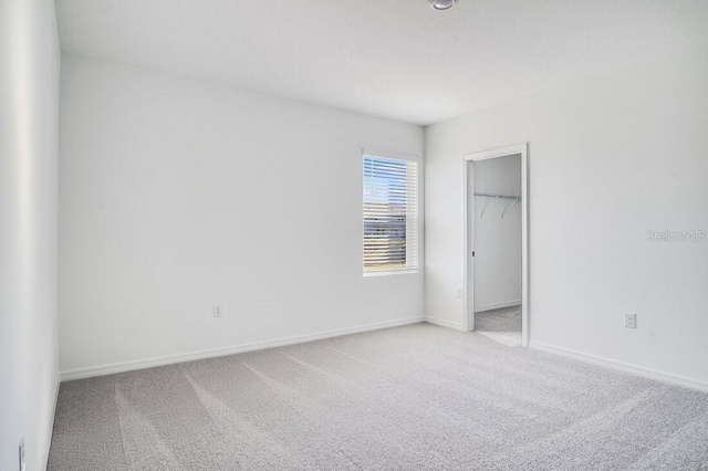 empty room with light colored carpet