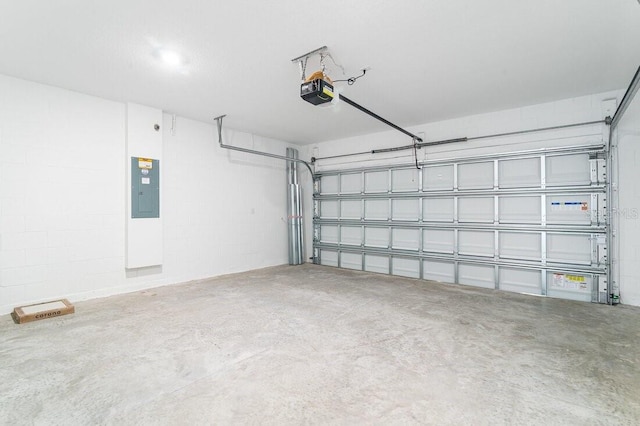 garage featuring a garage door opener and electric panel