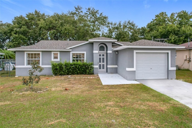 ranch-style home featuring a front yard and a garage