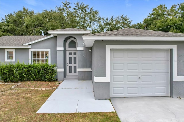 ranch-style home featuring a garage