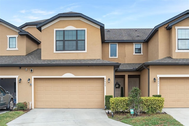 townhome / multi-family property featuring a garage