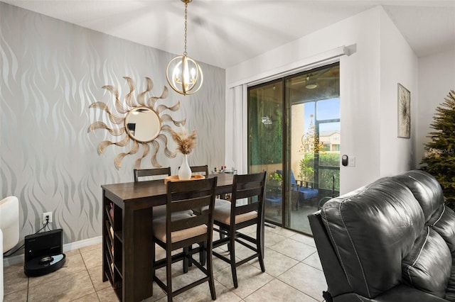 dining room featuring light tile patterned floors and an inviting chandelier