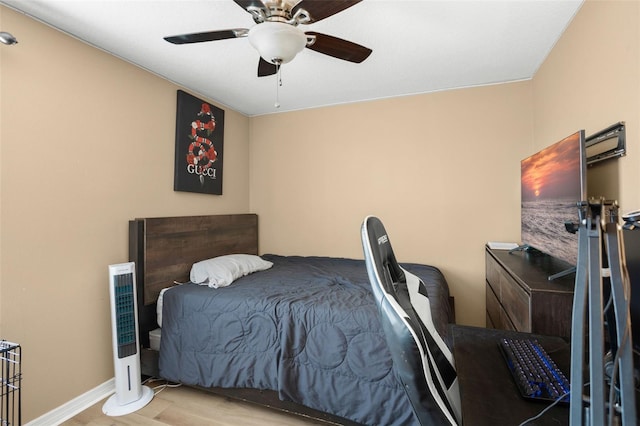 bedroom featuring ceiling fan and light wood-type flooring