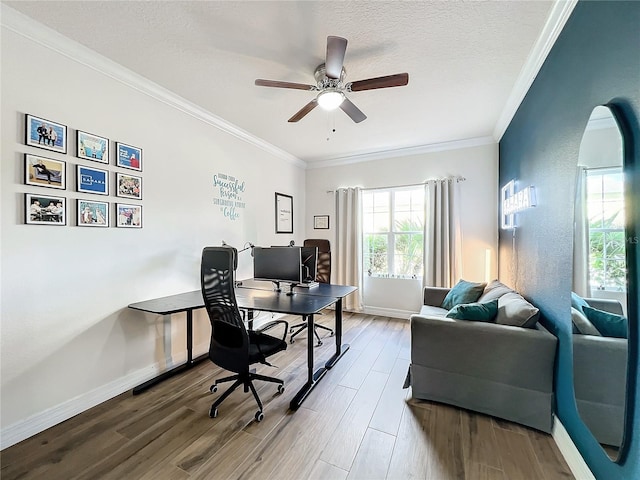 office space featuring ceiling fan, ornamental molding, a textured ceiling, and hardwood / wood-style flooring