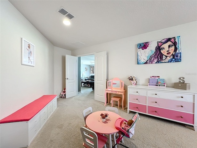 playroom featuring light colored carpet