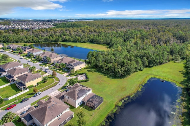 birds eye view of property with a water view