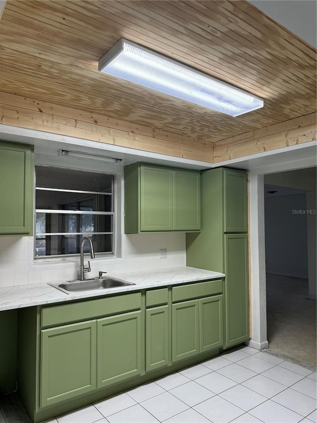 kitchen featuring green cabinets, wooden ceiling, sink, and light tile patterned floors