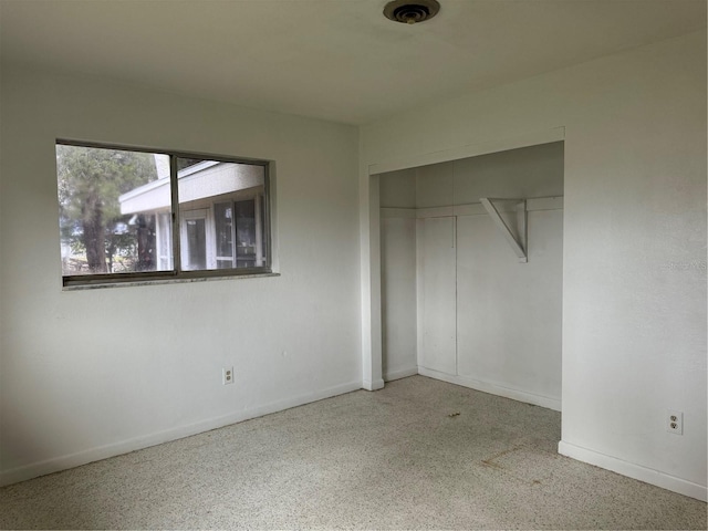 unfurnished bedroom featuring a closet