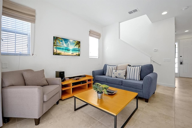 tiled living room featuring plenty of natural light